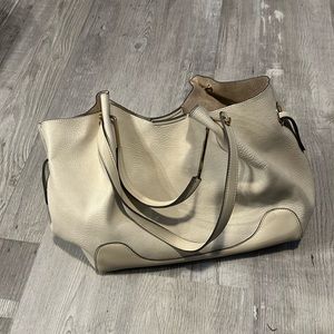 Cream colored purse.